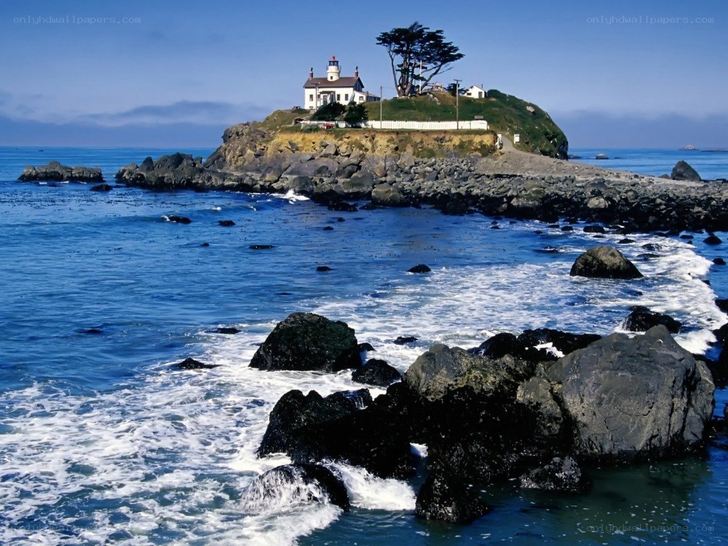 lighthouse on rocky island