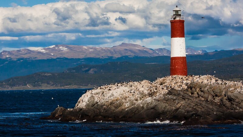 Lighthouse on Rocky Island — Blue, Dramatic, Afternoon, Photograph, Mountains, Birds