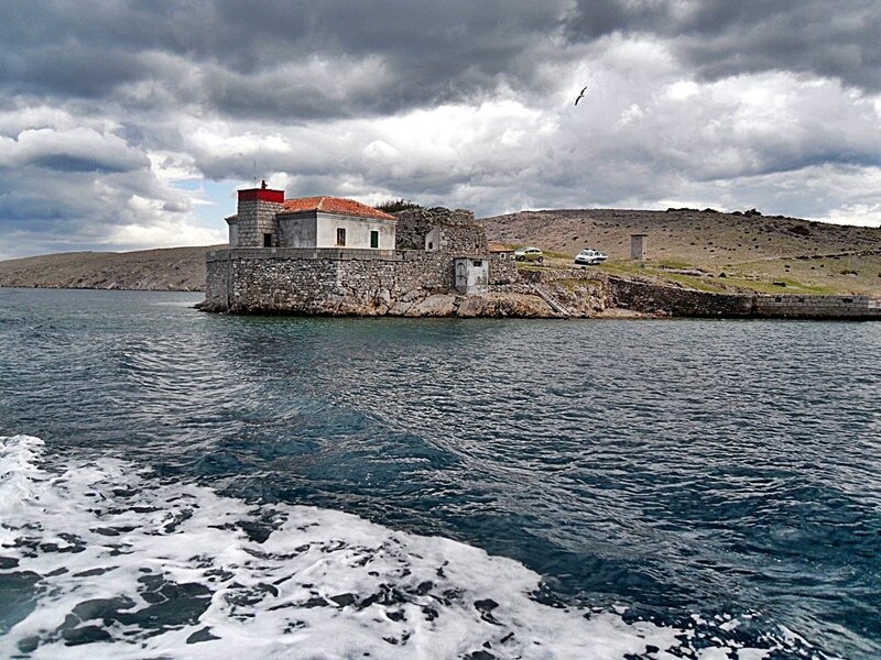 Lighthouse on Rocky Island — Blue, Dramatic, Afternoon, Photograph