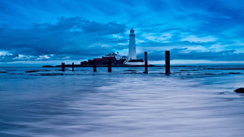 Lighthouse on Rocky Island — Blue, Dramatic, Night, Photograph, Clouds