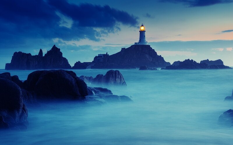 Lighthouse on Rocky Island — Blue, Dramatic, Night, Photograph, Rocks