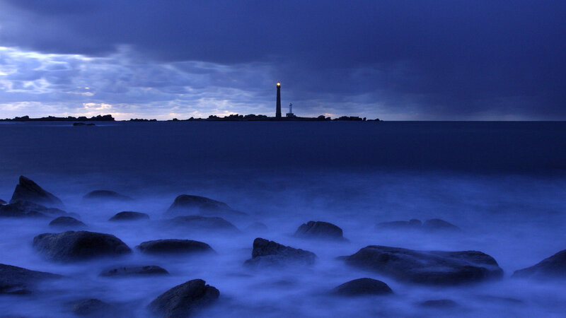 Lighthouse on Rocky Island — Blue, Dramatic, Night, Photograph, Sea