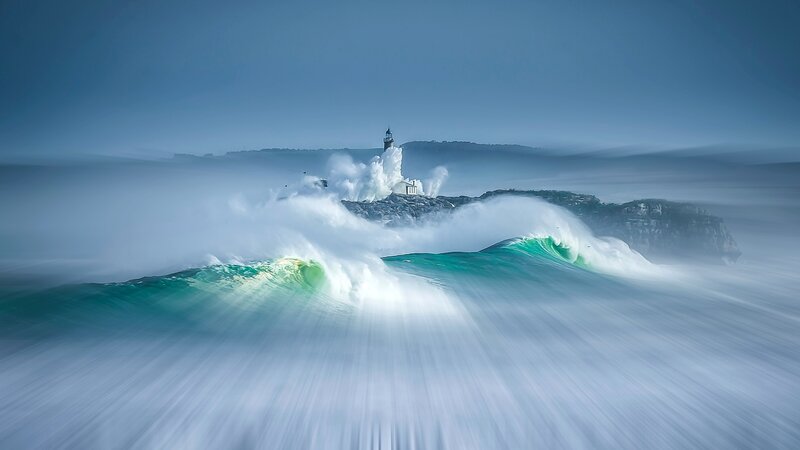 Lighthouse on Rocky Island — Blue, Dramatic, Photograph, Waves, Sea