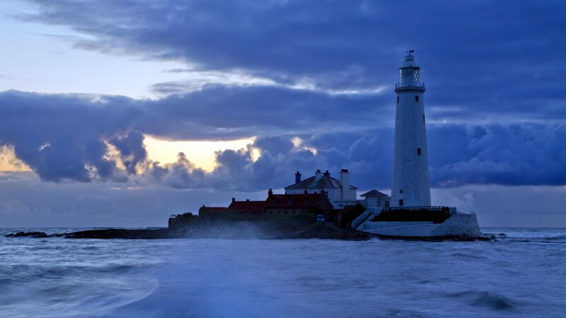 Lighthouse on Rocky Island — Blue, Dramatic, Sunset, Photograph, Sea