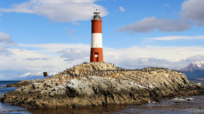 Lighthouse on Rocky Island — Blue, Serene, Afternoon, Photograph, Birds