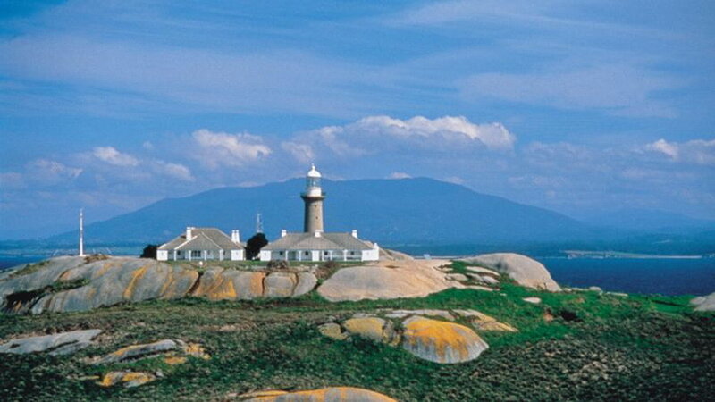 Lighthouse on Rocky Island — Blue, Serene, Afternoon, Photograph, Mountain