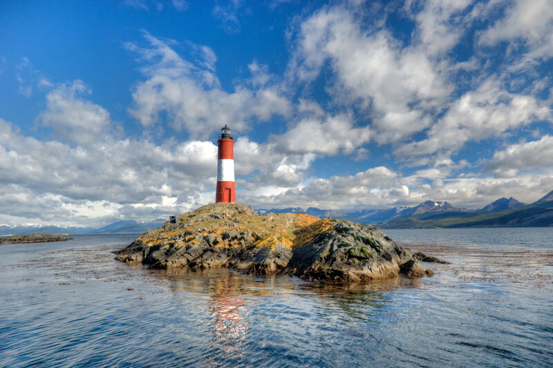 Lighthouse on Rocky Island — Blue, Serene, Afternoon, Photograph, Mountains