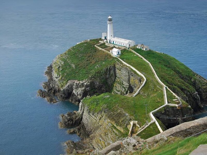 Lighthouse on Rocky Island — Blue, Serene, Afternoon, Photograph, Ocean, Cliffs