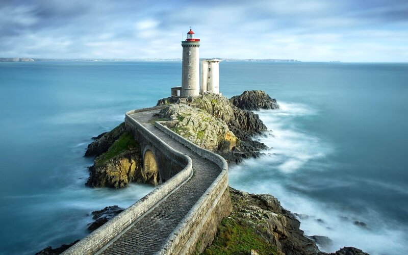 Lighthouse on Rocky Island — Blue, Serene, Afternoon, Photograph, Ocean, Path