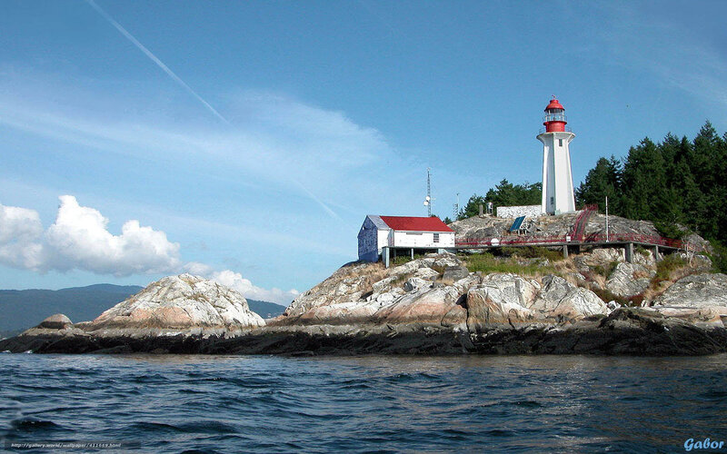 Lighthouse on Rocky Island — Blue, Serene, Afternoon, Photograph, Ocean, Trees