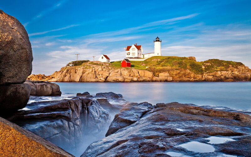 Lighthouse on Rocky Island — Blue, Serene, Afternoon, Photograph, Rocks