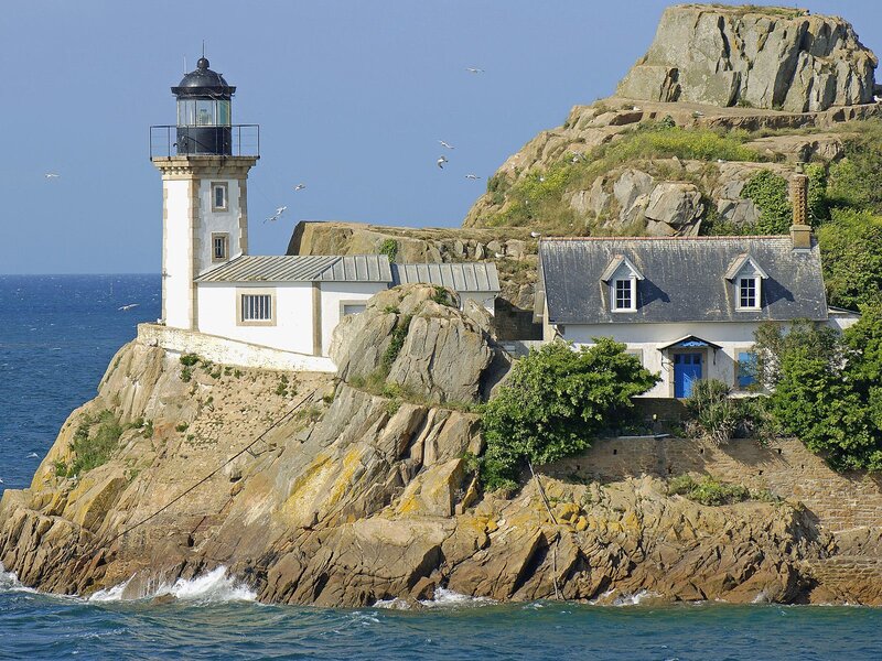 Lighthouse on Rocky Island — Blue, Serene, Afternoon, Photograph, Seagulls