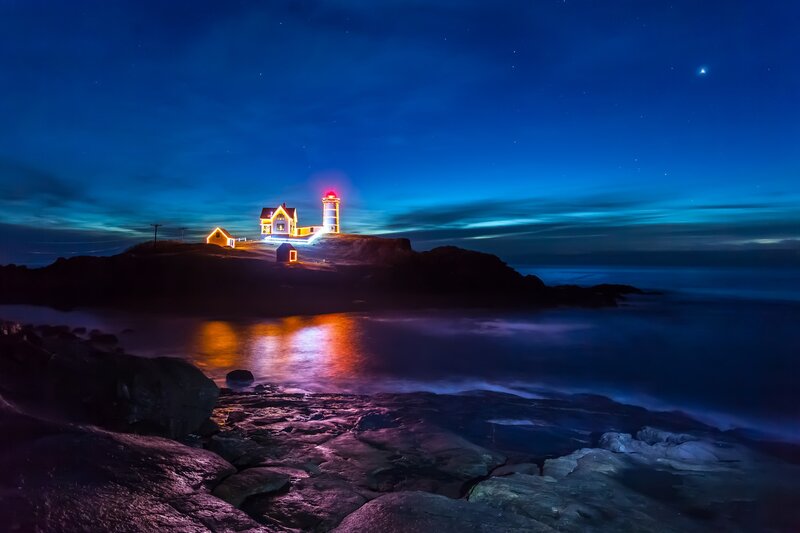 Lighthouse on Rocky Island — Blue, Serene, Night, Photograph, Ocean, Sky