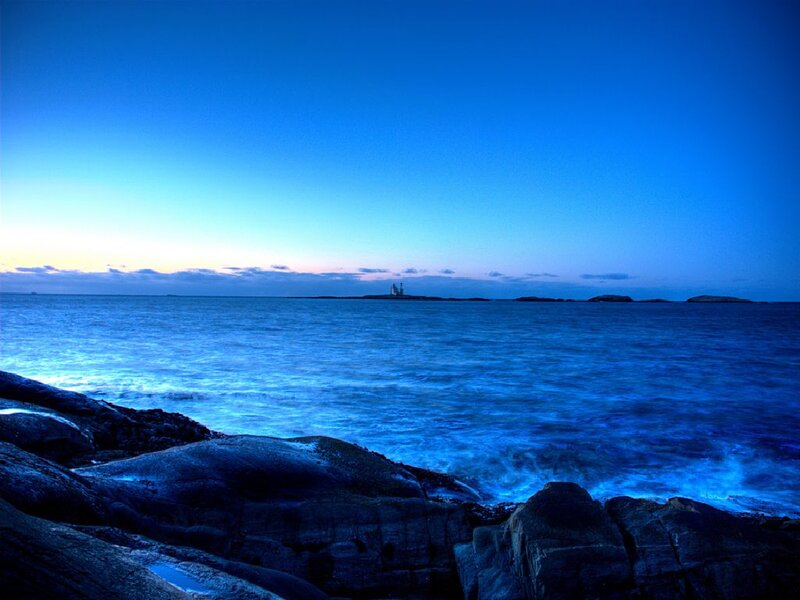 Lighthouse on Rocky Island — Blue, Serene, Night, Photograph, Ocean