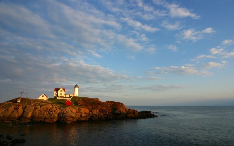 Lighthouse on Rocky Island — Blue, Serene, Sunset, Photograph, Ocean, Sky, Rocks
