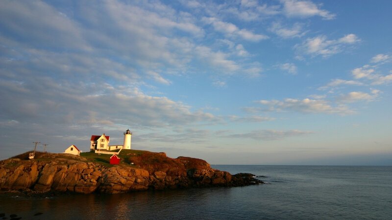 Lighthouse on Rocky Island — Blue, Serene, Sunset, Photograph, Ocean, Sky, Rocks, White