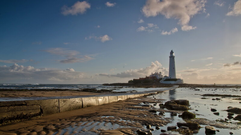 Lighthouse on Rocky Island — Blue, Serene, Sunset, Photograph, Ocean, Sky