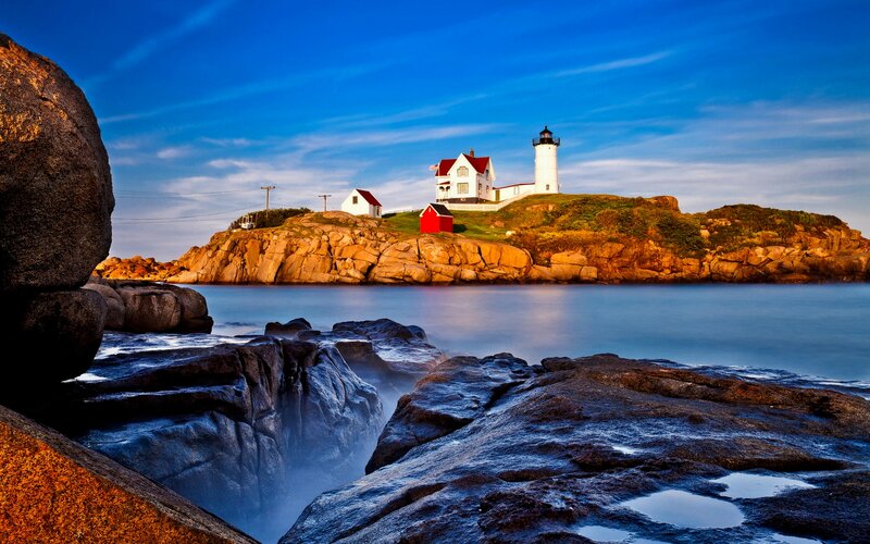 Lighthouse on Rocky Island — Blue, Serene, Sunset, Photograph, Rocks, Sea, Sky