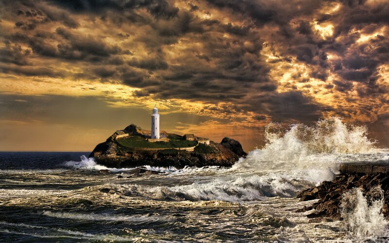 Lighthouse on Rocky Island — Brown, Dramatic, Sunset, Photograph