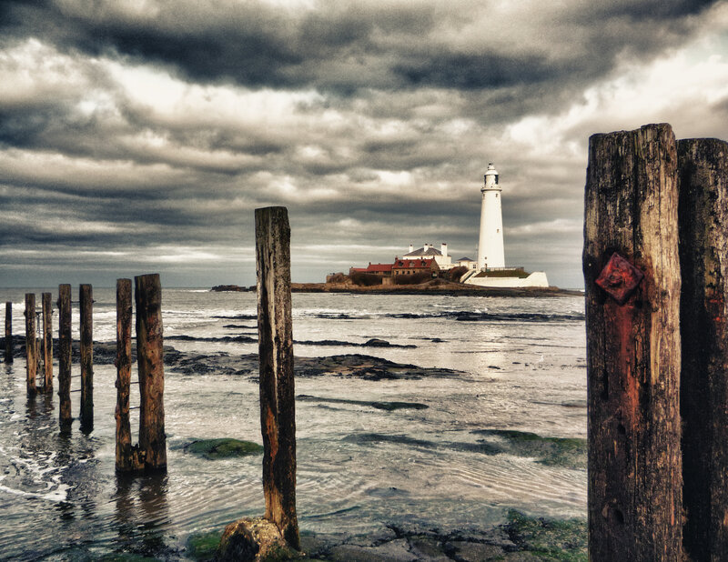 Lighthouse on Rocky Island — Gray, Dramatic, Photograph, Cloudy Sky