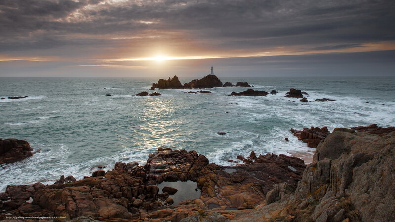 Lighthouse on Rocky Island — Gray, Dramatic, Sunset, Photograph, Ocean, Rocks