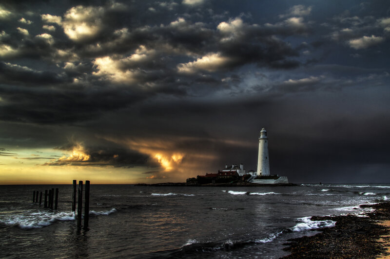 Lighthouse on Rocky Island — Gray, Dramatic, Sunset