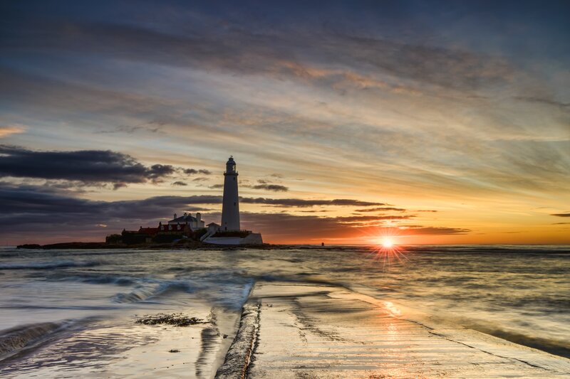 Lighthouse on Rocky Island — Orange, Dramatic, Sunset, Photograph, Sun, Ocean