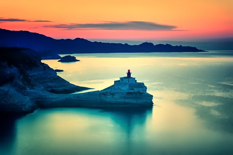 Lighthouse on Rocky Island — Orange, Serene, Sunset