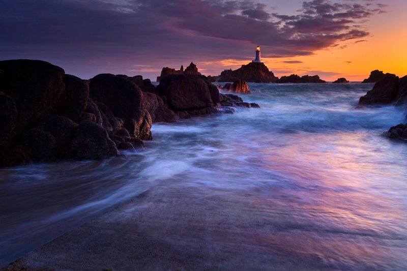Lighthouse on Rocky Island — Purple, Dramatic, Sunset, Photograph, Ocean
