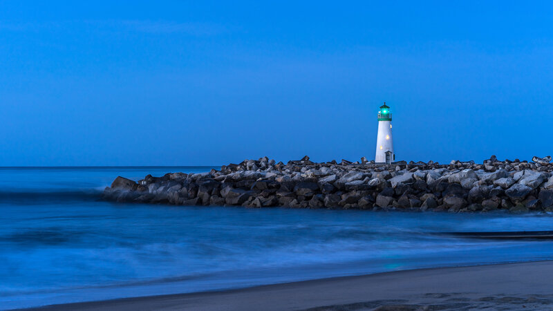 Lighthouse on Rocky Jetty — Blue, Serene