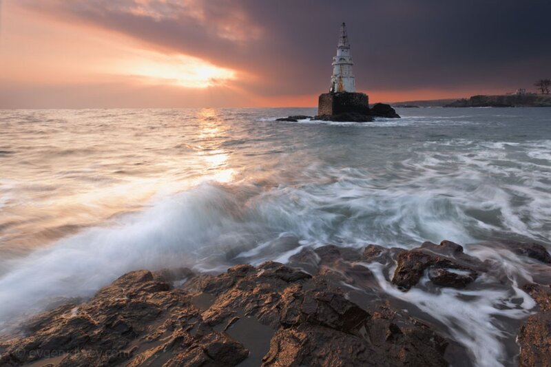 Lighthouse on Rocky Outcrop — Orange