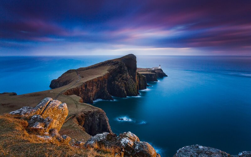 Lighthouse on Rocky Peninsula — Blue
