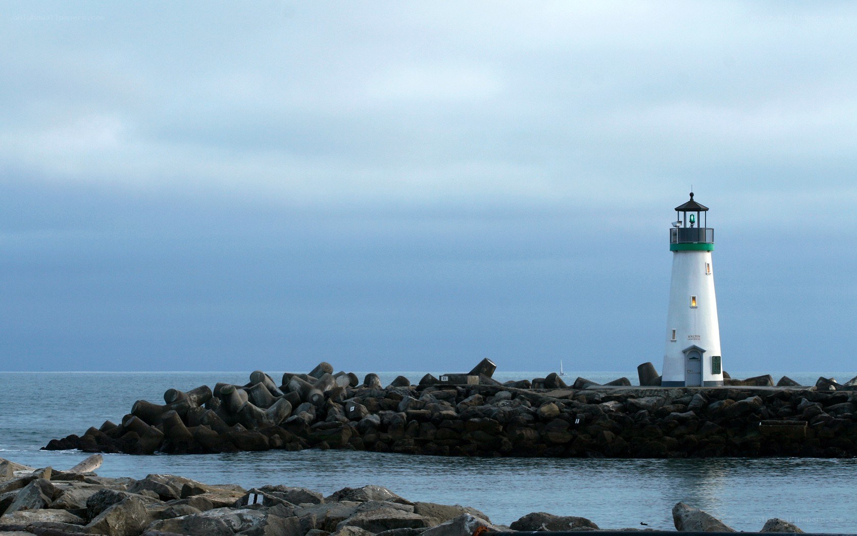 lighthouse on rocky pier