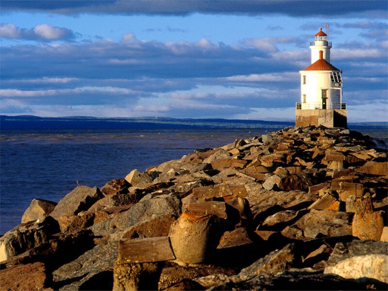 Lighthouse on Rocky Pier — Blue, Serene