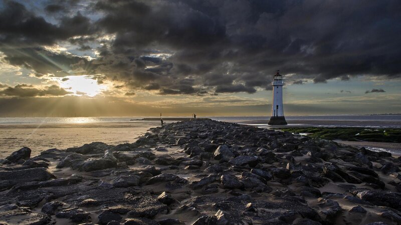 Lighthouse on Rocky Pier — Gray, Dramatic, Sunset, Photograph