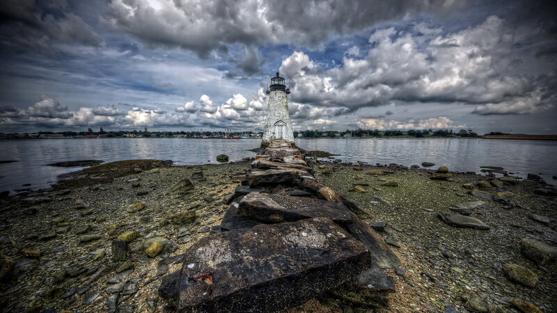Lighthouse on Rocky Pier — Gray, Dramatic