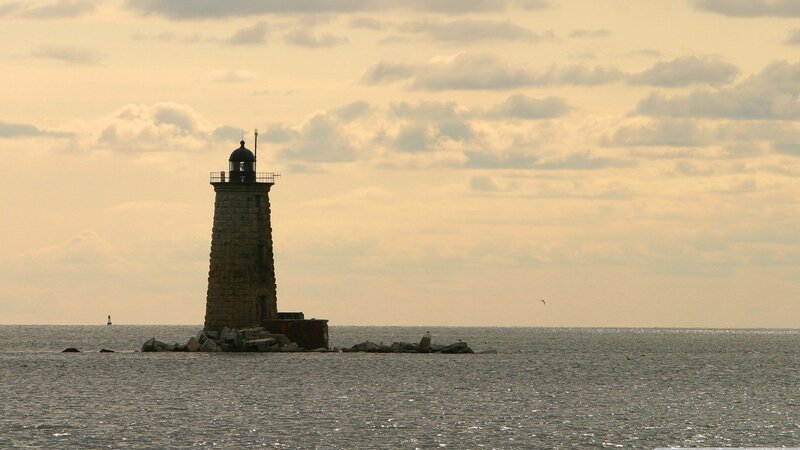 Lighthouse on Rocky Pier — Gray, Serene