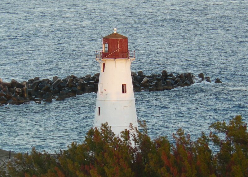 Lighthouse on Rocky Pier — White