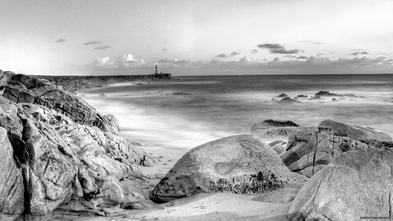 Lighthouse on Rocky Shore — Black, Serene