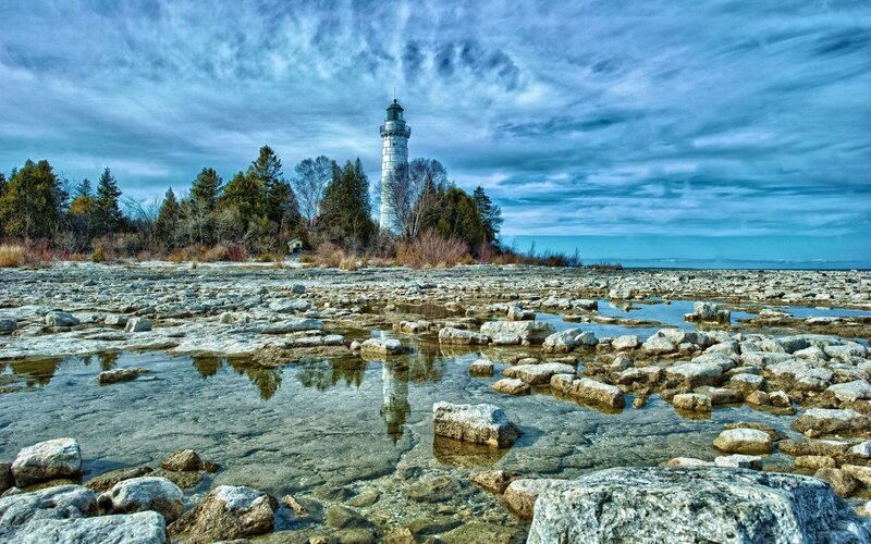 Lighthouse on Rocky Shore — Blue, Dramatic, Afternoon
