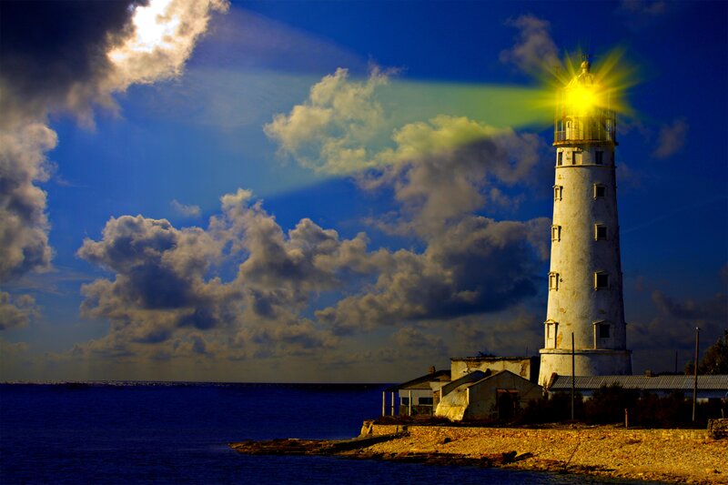 Lighthouse on Rocky Shore — Blue, Dramatic, Night, Photograph, Sea, Clouds