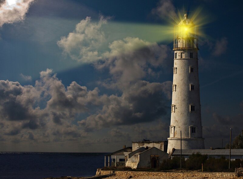 Lighthouse on Rocky Shore — Blue, Dramatic, Night, Photograph