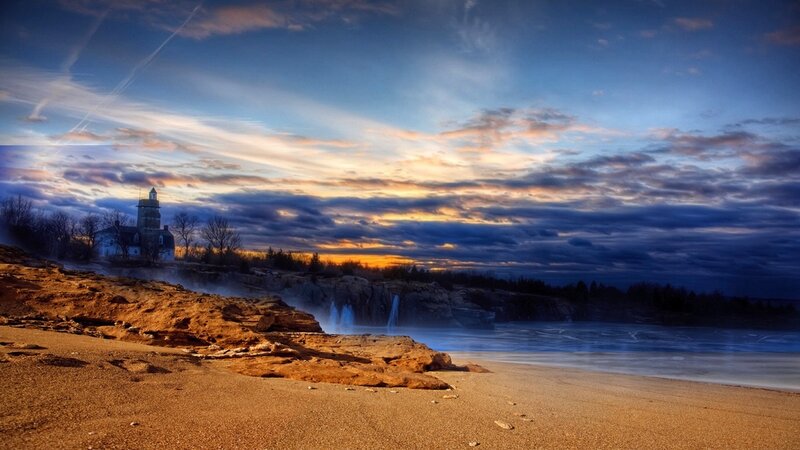 Lighthouse on Rocky Shore — Blue, Dramatic, Sunset, Photograph, Cliffs