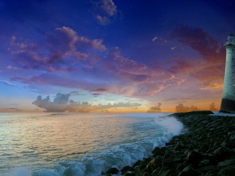 Lighthouse on Rocky Shore — Blue, Dramatic, Sunset, Photograph, Ocean, Sky
