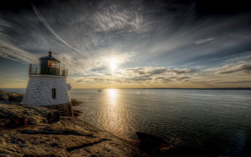 Lighthouse on Rocky Shore — Blue, Dramatic, Sunset, Photograph, Ocean, Sun