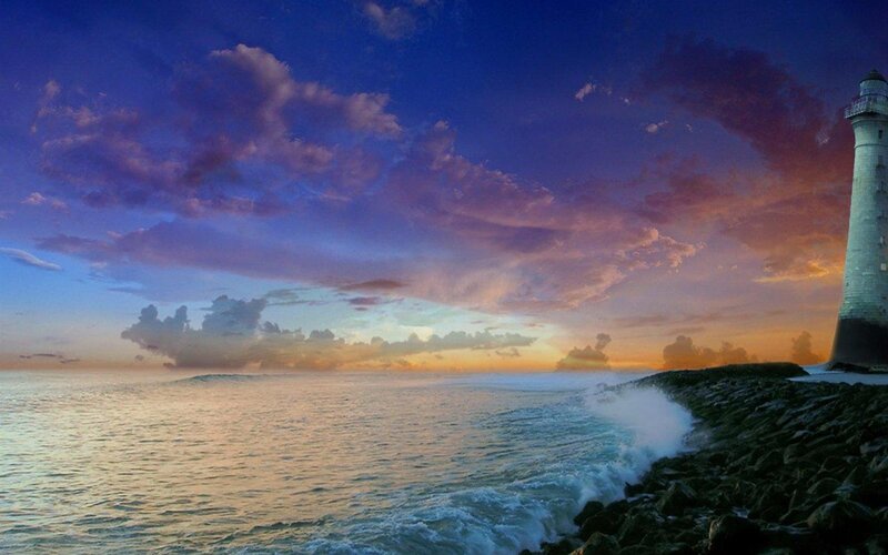 Lighthouse on Rocky Shore — Blue, Dramatic, Sunset, Photograph, Ocean