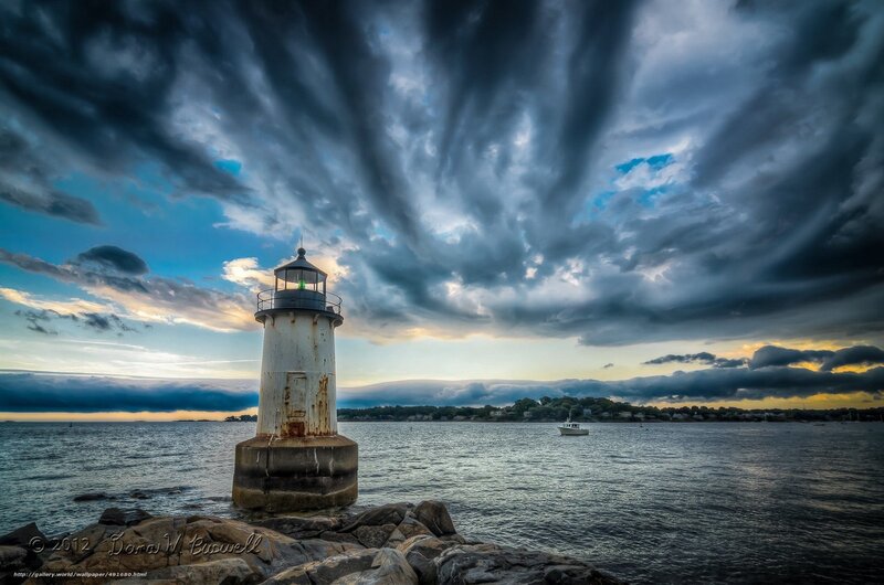 Lighthouse on Rocky Shore — Blue, Dramatic, Sunset, Photograph, Stormy Sky