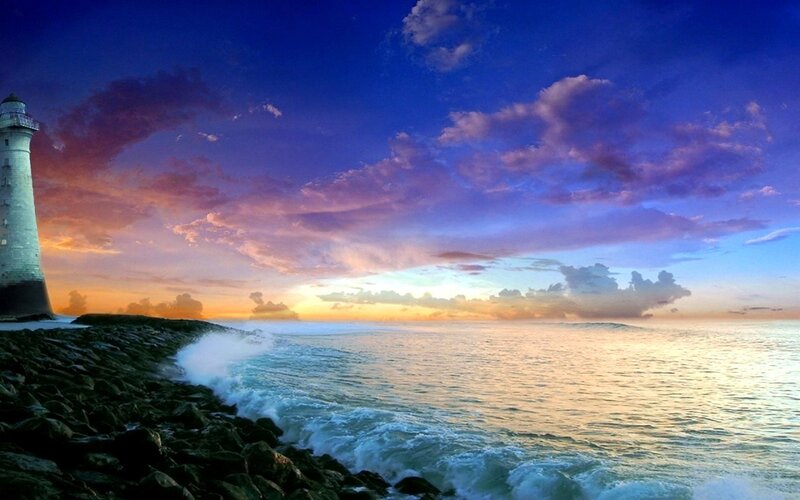 Lighthouse on Rocky Shore — Blue, Dramatic