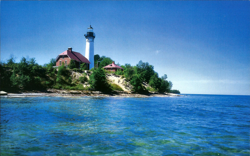 Lighthouse on Rocky Shore — Blue, Serene, Afternoon, Photograph, Building