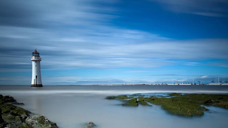 Lighthouse on Rocky Shore — Blue, Serene, Morning